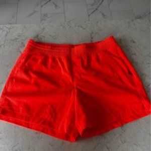 Old Navy mid rise stretch tech 5" inseam short in cora coral neon